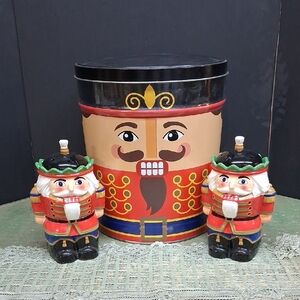 Nutcracker bundle of tin and 2 matching candle light figures.